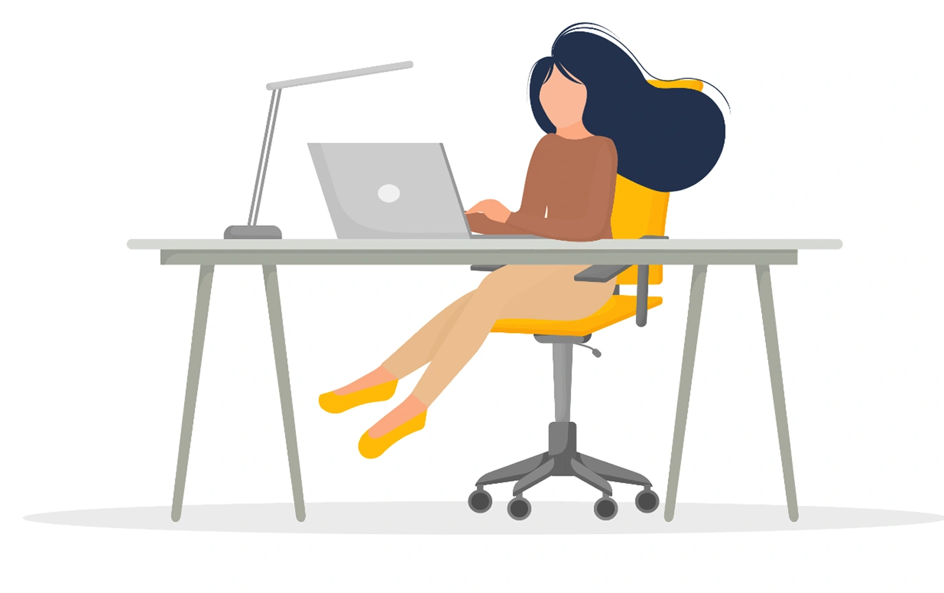 Woman working at desk with laptop.