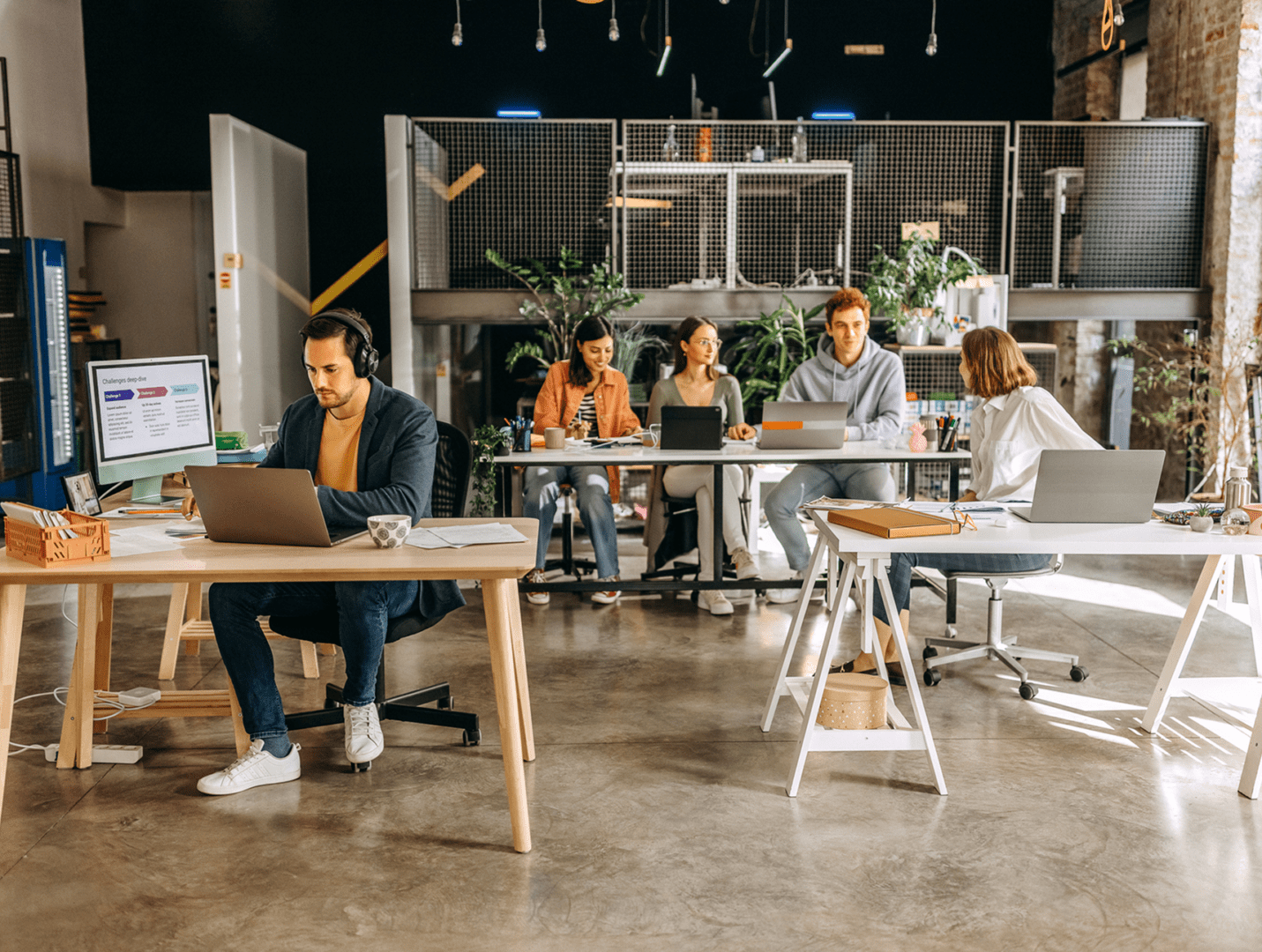 Coworking space with people working on laptops.